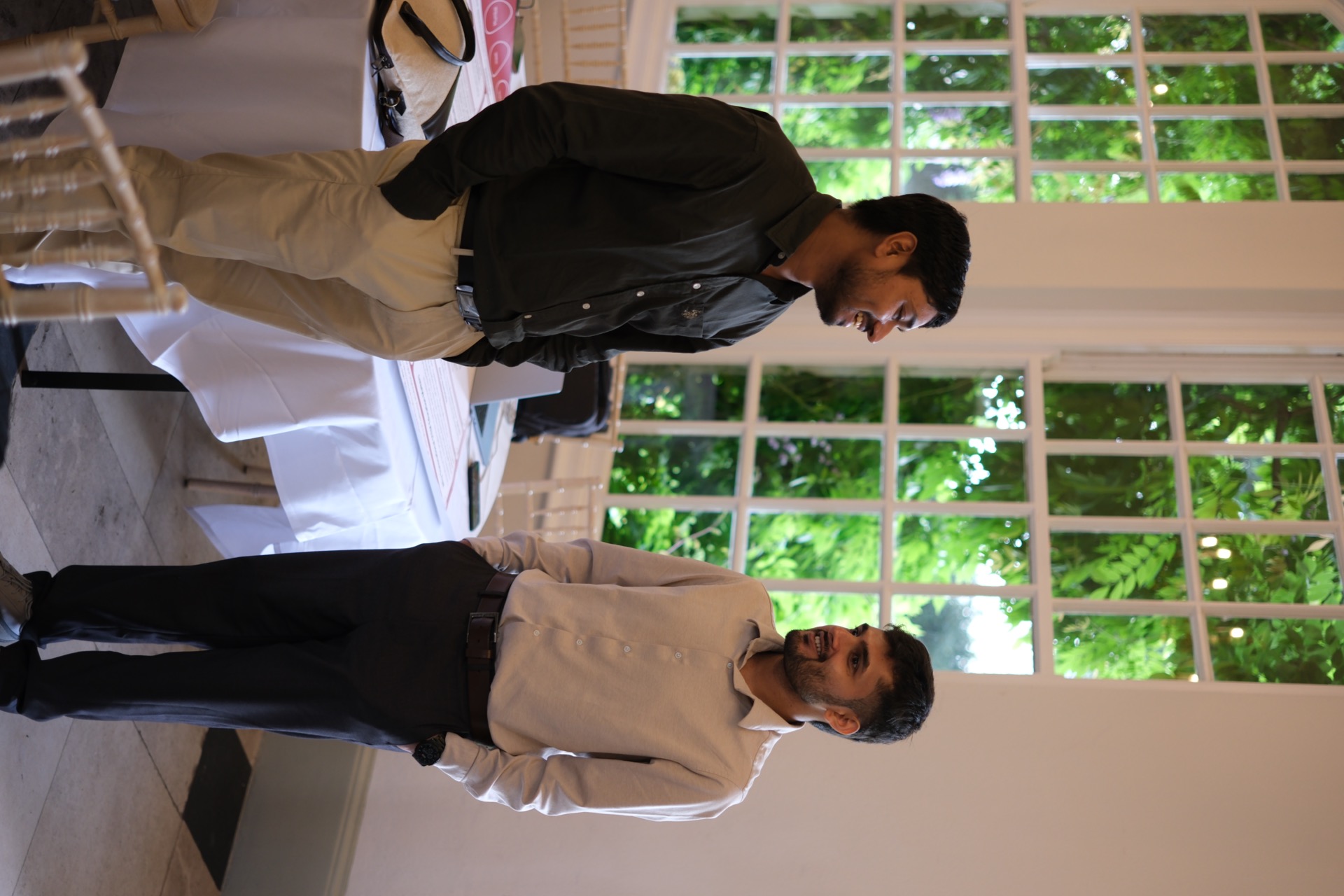 Two researchers in conversation during the workshop