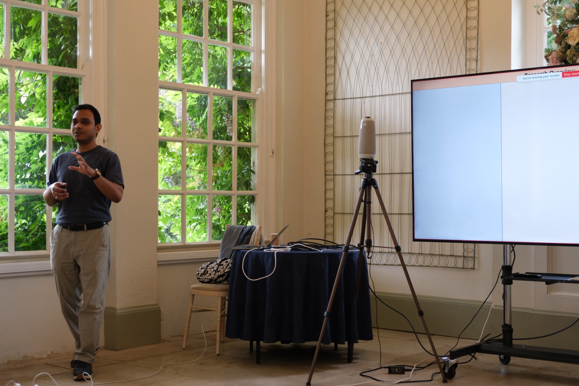 Presenter speaking with head and full upper body visible